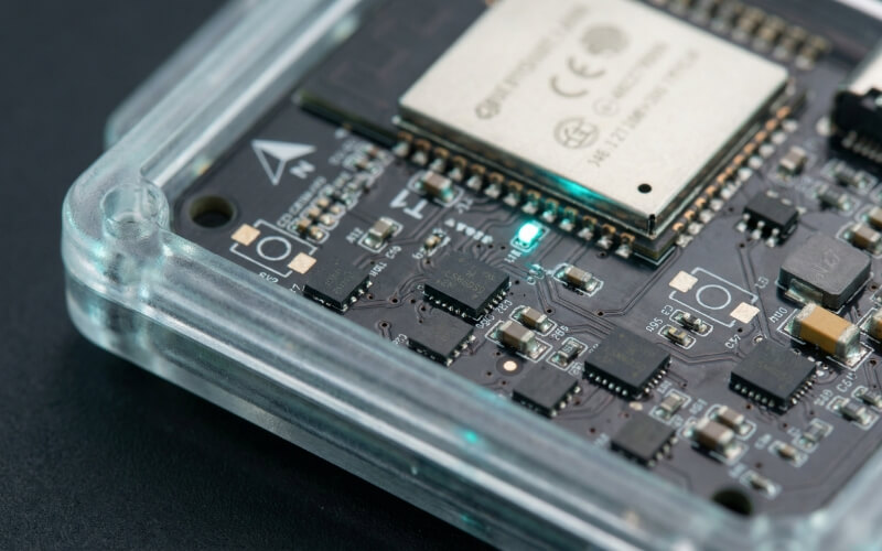 GeoShake T1 sensor close-up — ESP32-S3 microcontroller with four LSM6DSO MEMS accelerometers for community earthquake early warning